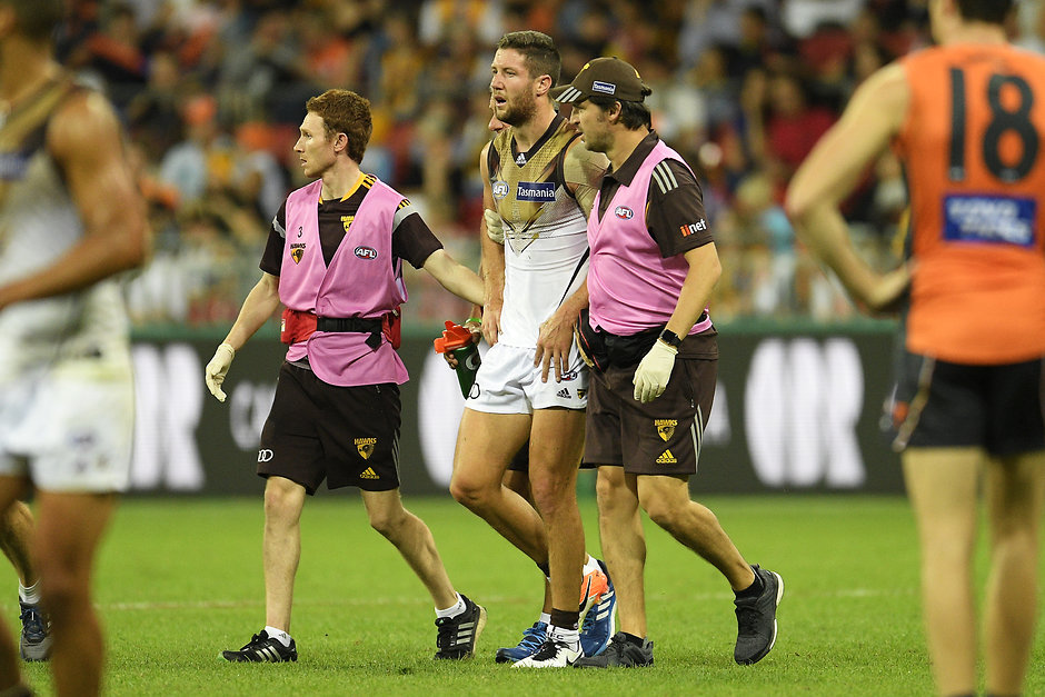 AFL Rd 06 - GWS v Hawthorn SYDNEY, AUSTRALIA - APRIL 30: James Frawley of the Hawks is assisted from the field during the round six AFL match between the Greater Western Sydney Giants and the Hawthorn Hawks at Spotless Stadium on April 30, 2016 in Sydney, Australia. (Photo by Brett Hemmings/AFL Media/Getty Images)